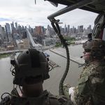 Explosive Ordnance Disposal Technicians assigned to Explosive Ordnance Disposal Group (EODGRU) 2, fly past the New York City skyline on a MH-60S Sea Hawk helicopter assigned to “The Night Dippers” of Helicopter Sea Combat Squadron (HSC) 5 as part of Fleet Week New York 2017. (U.S. Navy photo by Mass Communication Specialist 2nd Class Charles Oki)